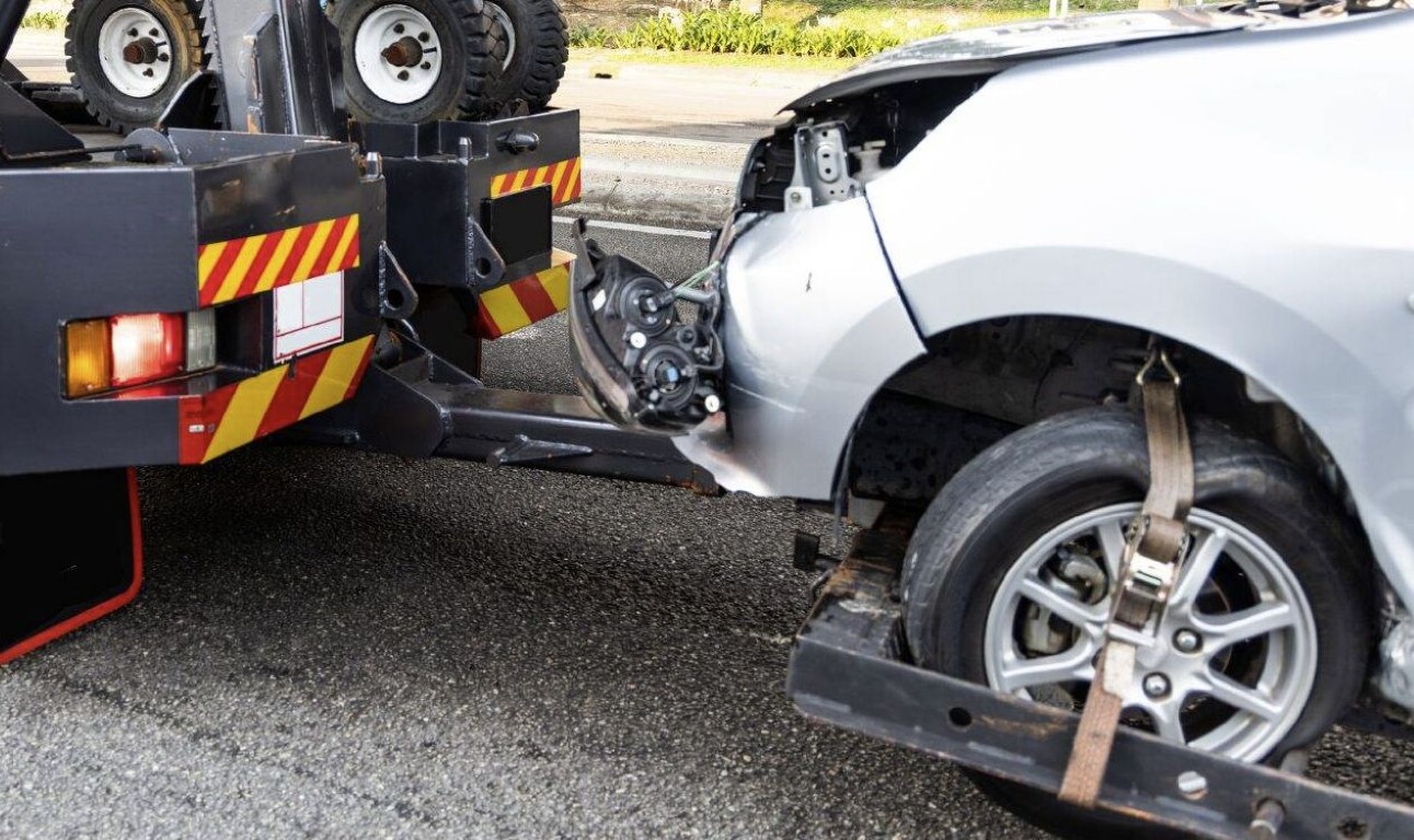 Roadside assistance towing a damaged vehicle in Bay Shore, NY